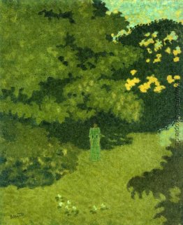Frau in einem grünen Kleid in einem Garten Frau in einem grünen Kleid in einem Garten