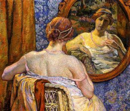 Frau an einem Spiegel