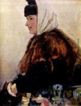 Porträt der jungen Frau im Pelzmantel mit muff