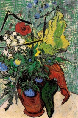 Wilde Blumen und Disteln in einer Vase