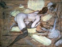 Nude Frau liegend auf gelbem Kissen