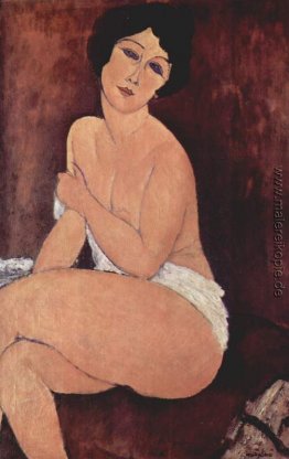 Nude Sitz auf einem Sofa