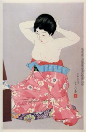 Eine Frau vor dem Spiegel