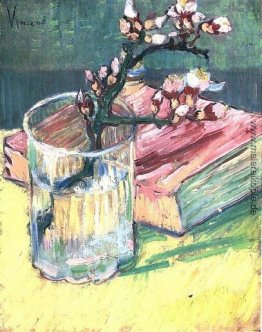 Blühende Mandel-Niederlassung in einem Glas mit einem Buch