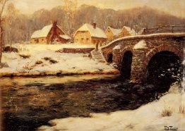 Eine steinerne Brücke über einen Bach im Winter Eine steinerne Brücke über einen Bach im Winter