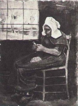 Frau Schalen-Kartoffeln in der Nähe von einem Fenster Frau Schalen-Kartoffeln in der Nähe von einem Fenster