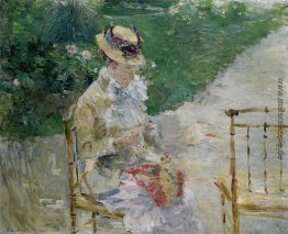 Junge Frau Sewing im Garten Junge Frau Sewing im Garten
