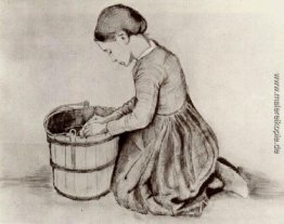 Mädchen kniend vor einem Eimer Mädchen kniend vor einem Eimer