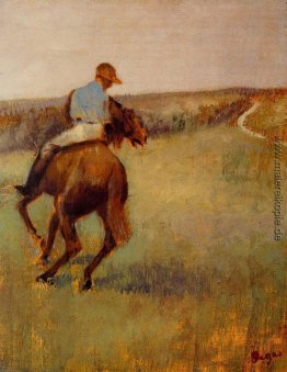 Jockey in Blau auf einem Kastanien-Pferd Jockey in Blau auf einem Kastanien-Pferd