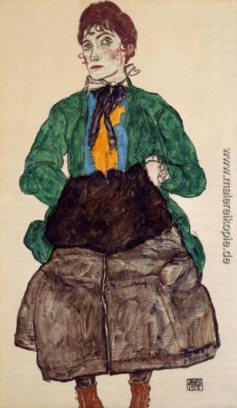 Frau in eine grüne Bluse und Muff Frau in eine grüne Bluse und Muff