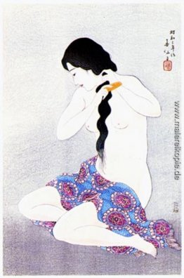 Woman combing hair Woman combing hair