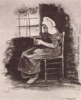 Frau Schalen-Kartoffeln in der Nähe von einem Fenster Frau Schalen-Kartoffeln in der Nähe von einem Fenster