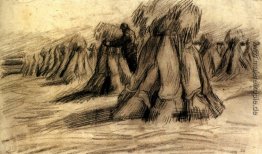 Stooks und ein Bauer Stapel Garben Stooks und ein Bauer Stapel Garben